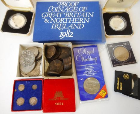 A collection of assorted coins including American dollars: commemorative crowns and cased coinage and an ivory handled carvin