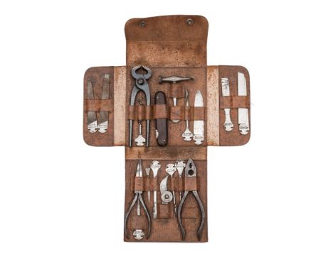 An early 20th century leather cased field tool kit by Bonsa, Germany:, comprising a rosewood mounted handle with thirteen att