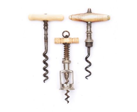 An early 20th century bone handle miniature spring twin pillar perfume bottle corkscrew:, together with an ivory handled cork