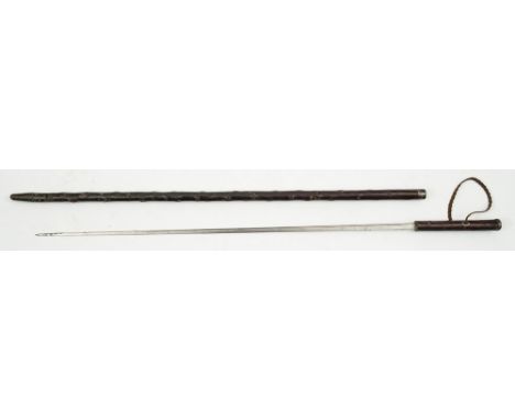 An Edwardian silver mounted swordstick:, the straight single edge blade in a naturalistic stick like case with engraved silve