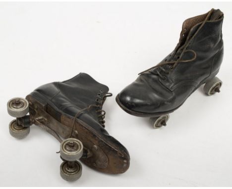 A pair of early 20th century 'Gloria -Special' roller skates:, solid cast aluminium wheels, cast iron truck and brace bar fit