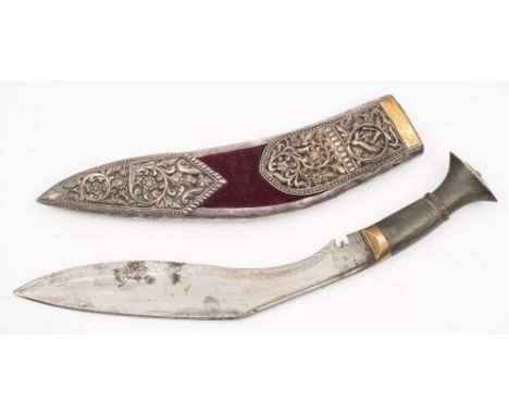 A kukri in a white metal mounted presentation scabbard:, of traditional form with horn handle, the scabbard with floral decor