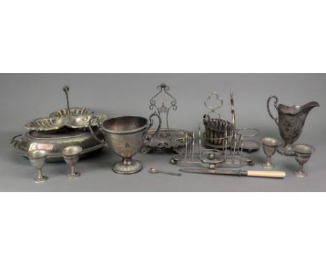 A George III style electroplate helmet shape milk jug and two handled sugar basin, foliate engraved, cased fish eaters and va