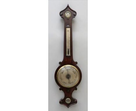 Joseph Somalvico &amp; Co, Londra: an early Victorian carved rosewood case wheel barometer thermometer, hygrometer, signed on