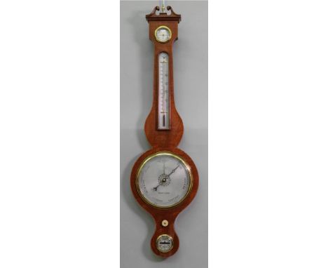 Negretti &amp; Zambra: a reproduction George III style mahogany boxwood and ebony strung wheel barometer thermometer hygromet
