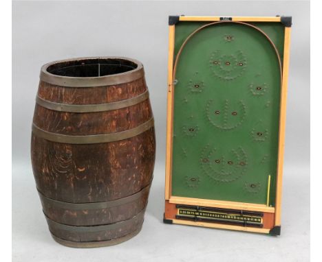 A brass bound oak brandy barrel, adapted as a stick stand, with metal drip tray, 62cm high, and a Key, London bagatelle board