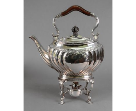 A late Victorian silver tea kettle on spirit heater stand, Harry Wright Atkin, Sheffield 1894, in Regency style, embossed wit