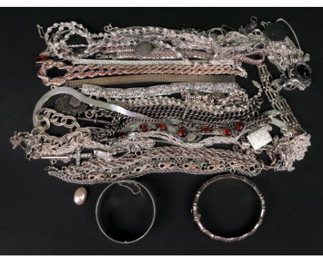 A large collection of silver jewellery, including: a hinged silver bangle engraved with stars to a textured ground; another h