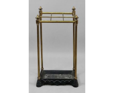 A reproduction Victorian style tubular brass six division stick stand, with cast iron drip tray base, 32cm wide x 63cm high x