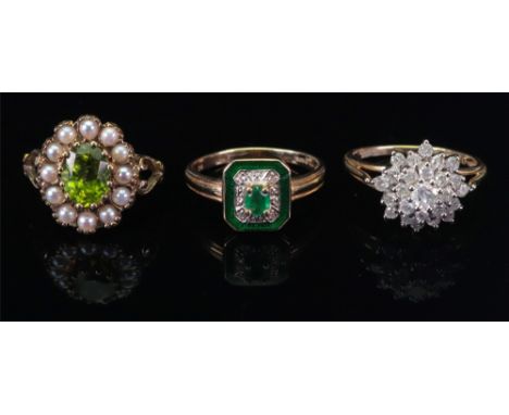 A 14ct gold emerald, diamond and green enamelled plaque ring, the central oval-cut emerald claw-set to an inner diamond surro