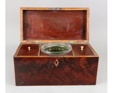 A George III rectangular mahogany boxwood banded tea caddy, the hinged cover enclosing two lidded compartments and a cut glas