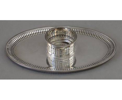 An oval inkstand base, possibly Mexican, by Y. Juarez, with a bead edge and pierced sides, cylindrical receiver lacking inkwe