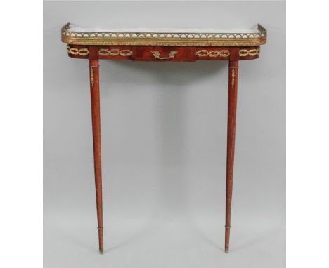 A reproduction Empire style mahogany gilt metal mounted console table, of narrow proportions, the veined marble top above a f