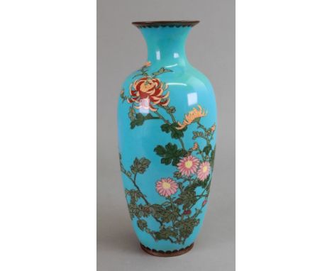 A cloisonne enamel baluster vase Meiji period, with flowering chrysanthemums on a turquoise ground, 25cm high.
