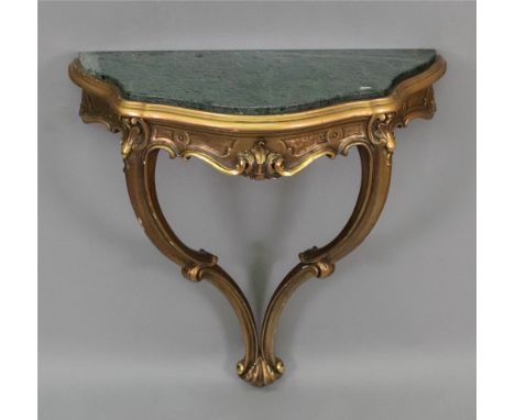 A reproduction mid 18th century style carved giltwood console table, the verde antico marble top of serpentine outline, 60cm 