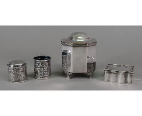 An Edwardian octagonal silver tea caddy, Messrs Barnards, London 1908, with domed hinged cover, on four leaf and stepped feet