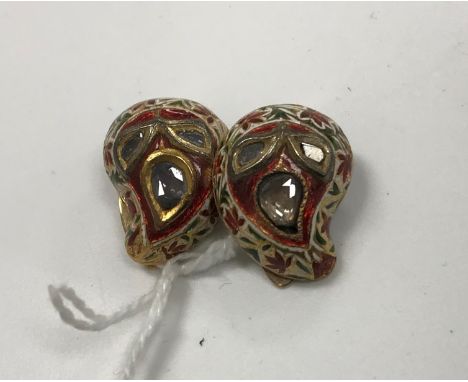 A pair of yellow metal and enamel decorated diamond set earrings of leaf design, approx total carat weight 0.5 CONDITION REPO