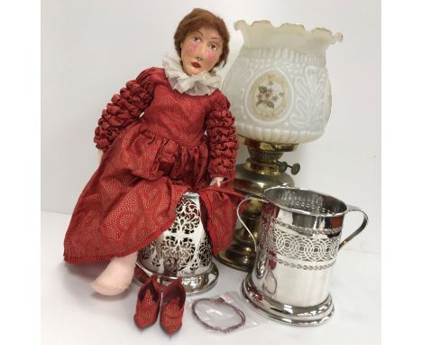 Two 20th Century EPNS pierced cylindrical twin-handled bottle coasters, together with a 20th Century brass oil lamp with milk