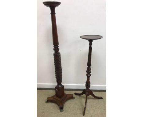 A mahogany and rope twist decorated torchère or plant stand in the early 19th Century manner raised on a quadruped platform b