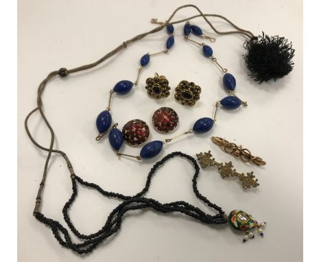 A collection of jewellery comprising a bar brooch, a yellow metal mounted blue bead necklace, a pair of enamelled clip-on ear