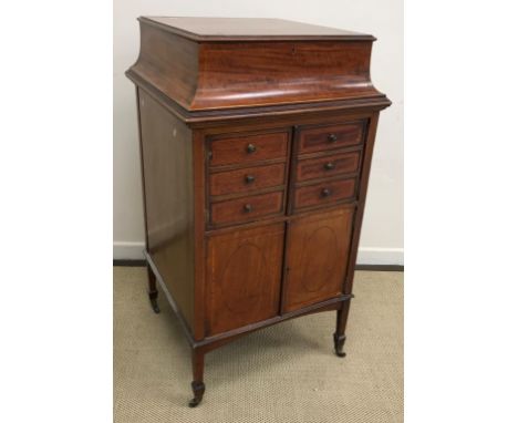 A collection of furniture comprising an Edwardian mahogany and inlaid gramophone cabinet, the top section with hinged lid ope