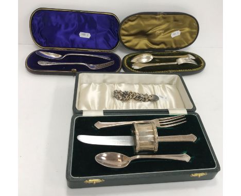 A cased Christening set comprising knife, fork and spoon by Elkington &amp; Co, Birmingham 1961 and associated napkin ring, a