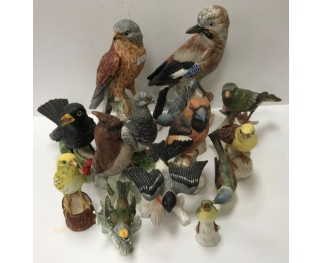A collection of fourteen Goebel bird figures various including "Falcon" (CV110-1969) 22.5 cm high, "Jay" (CV94) 23.2 cm high,