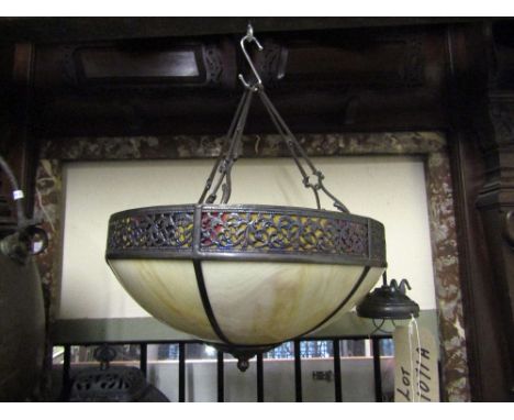 A reproduction ceiling lantern of circular form with pierced framework and simulated marbled glass panels