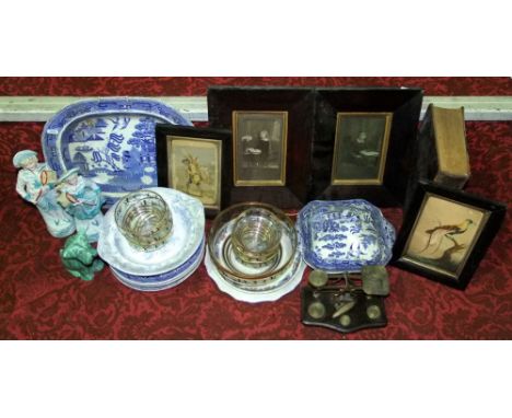 A collection of 19th century blue and white printed Willow pattern ceramics including a tureen and cover, oval meat plates, e