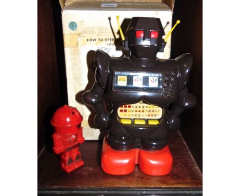 A Japanese plastic robot fitted with a fruit machine together with a further robot (2)