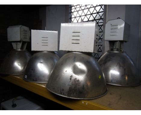 A collection of six vintage industrial light units with chromium shades