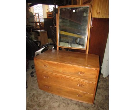 An Ercol light elm dressing table, the raised mirror upon a base fitted with three long drawers.