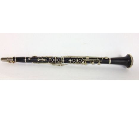 A leather cased clarinet by C Mahillon & Co of London.