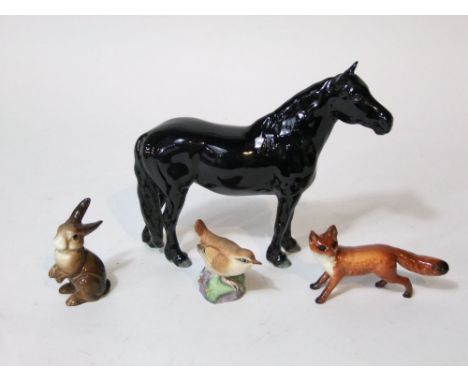 A Beswick type model of a black fell pony, a Beswick fox, a Beswick rabbit and a Royal Worcester model of a wren