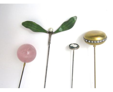 Four Edwardian hat pins consisting of one Austrian silver enamel and pearl art nouveau example, hall marked and stamped G.A.S