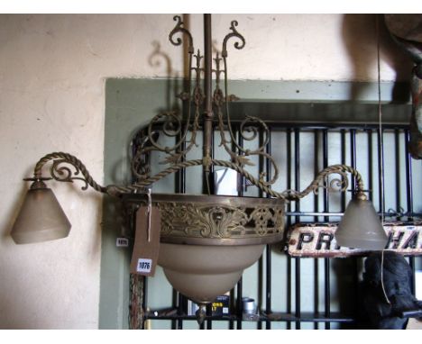 An Edwardian cast brass pendant ceiling light with two additional branches and etched glass shade