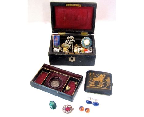 A leather box containing costume jewellery including a silver malachite brooch, also with an inlaid Egyptian style cigarette 