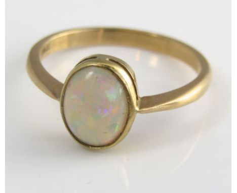 An 18ct ring with bezel set opal, size P/Q, 3g