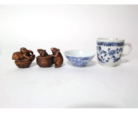 A small oriental open bowl with painted blue and white exotic bird detail and four character mark to base together with an 18
