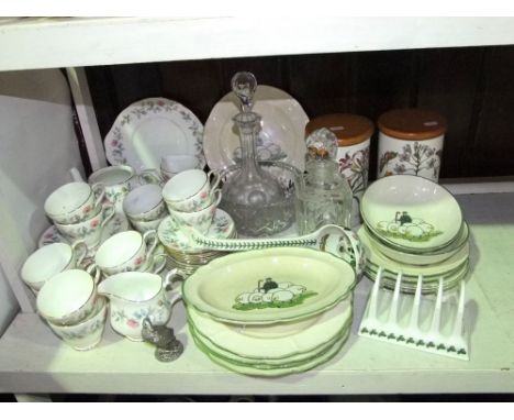 A large Portmeirion Botanic Garden ladle, a pair of large matching storage jars and covers and a toast rack, together with a 