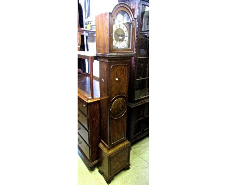 A good quality walnut cased grandmother clock, the 20cm broken arch dial with applied spandrels and silvered chapter ring wit