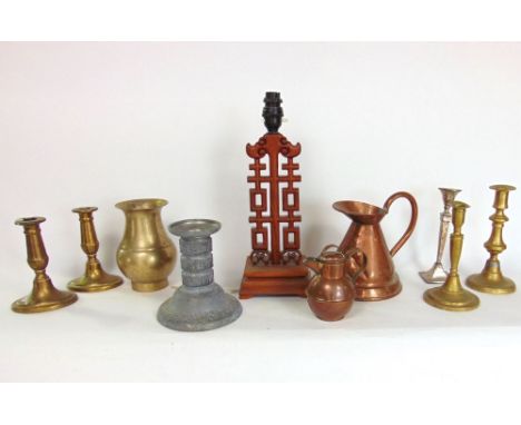 A box of metal ware to include antique copper jug, interesting cast pewter candlestick and further antique brash candlestick 