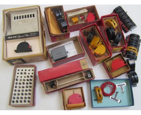 Trix electrical and line side items to include, whistle signal board, two yard lamps, one coloured light signal, switches sui