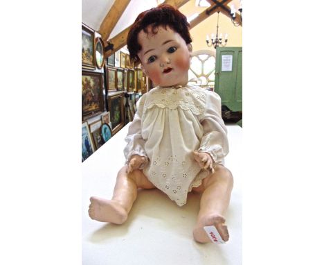 Armand Marseilles bisque headed doll, with fixed eyes open mouth and two teeth and articulated limbs