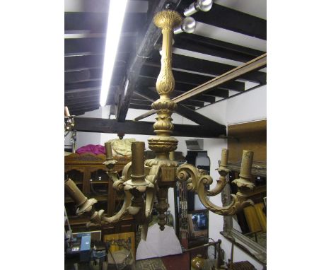 A carved timber six branch ceiling light with carved and later painted finish