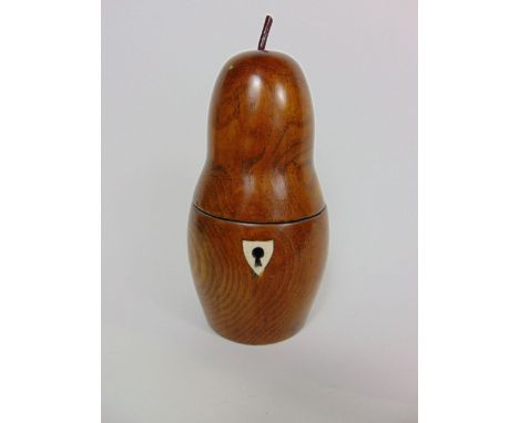 Antique style elm tea caddy in the form of a pear, the hinged lid enclosing an ivory handled marquetry top with ebonised inte