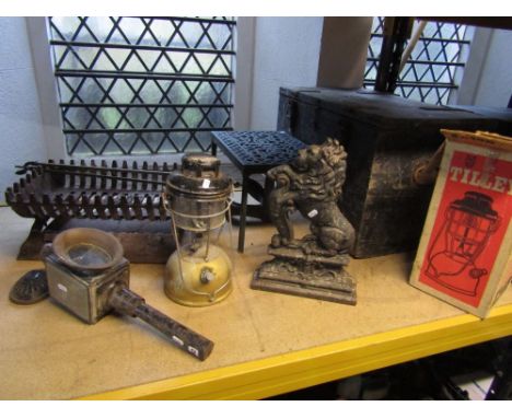 A 19th century cast iron door stop in the form of a lion, a coach lamp,a  heavy iron trivet, fire basket, together with two v