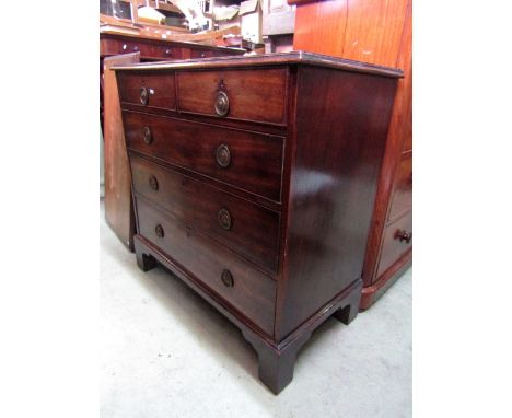 A Georgian mahogany chest of three long and two short drawers on bracket supports, 95 cm wide