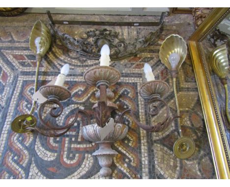A carved wooden and scrolled metal three branch wall light together with a pair of lights with flexible coiled stems and shel