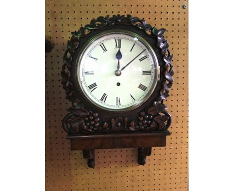 An 8 inch dial single fusee wall clock, fine English carved wall and bracket, carved with leaves and poker work